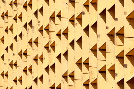 The photograph of a facade with symmetrically arranged windowsの写真素材