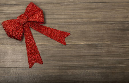 Christmas wood Background with Red Ribbonの写真素材