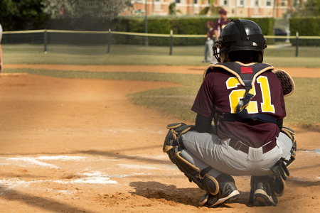 Kids playing Baseball in youth leagueの写真素材