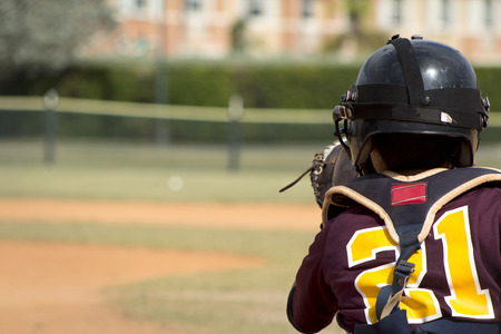 Kids playing Baseball in youth leagueの写真素材
