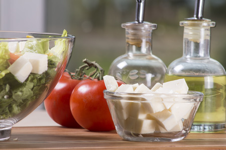 Traditional greek salad with corn, feta cheese, tomatoes and lettuce.の写真素材