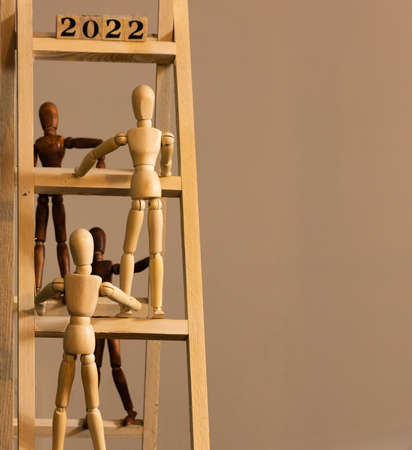 Figurines on a ladder and climbing up to new yearの写真素材