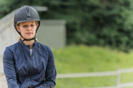 Close up on a blond girl with a helmetの写真素材