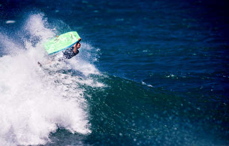 Surfing at Los Tubos Beach, ManatÃ­, Puerto Rico.の写真素材