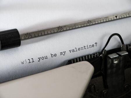 Old vintage Typewriter typing "will you be my valentine?"の写真素材
