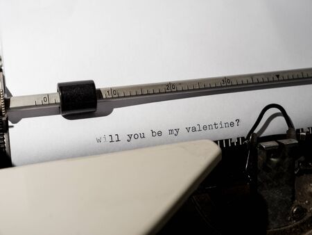 Old vintage Typewriter typing "will you be my valentine?"の写真素材