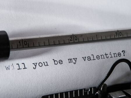 Old vintage Typewriter typing "will you be my valentine?"の写真素材