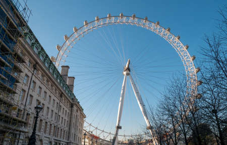 London Eye Ferris Wheel with a Blue Sky.のeditorial素材