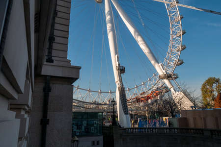 London Eye Ferris Wheel with a Blue Sky.のeditorial素材