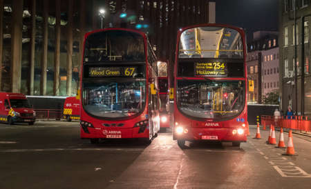 View of Streets of London with red buses and cars.のeditorial素材