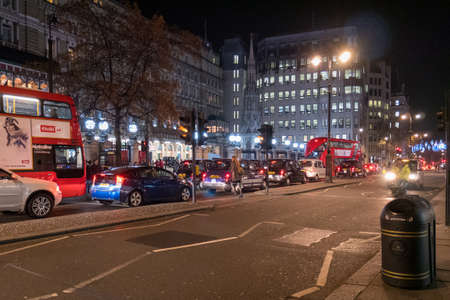 View of Streets of London with red buses and cars.の写真素材