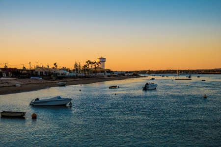 Shore of Faro Beach at Sunset.の写真素材