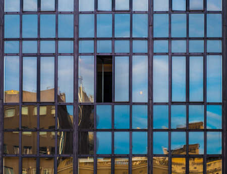 Only one open window in a office building.