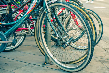 Barcelona, Spain - December 21, 2017: Close of Bicycle wheels on the street.の写真素材