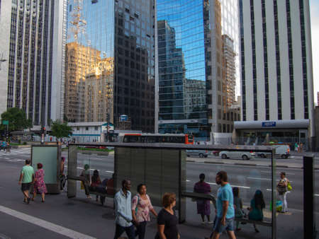 SAO PAULO, BRAZIL - APRIL 18, 2014: People waiting for the bus on Paulista Avenueのeditorial素材