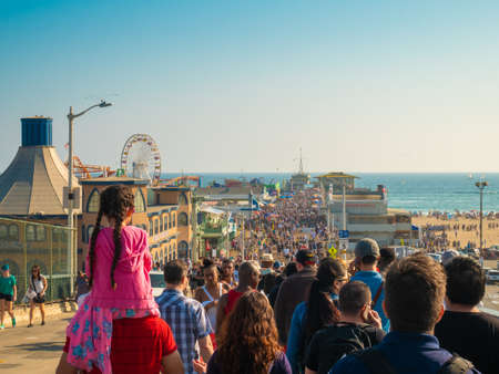 SANTA MONICA, USA - JUNE 25, 2016: View of crowd walking by Santa Monica pier in summer.のeditorial素材