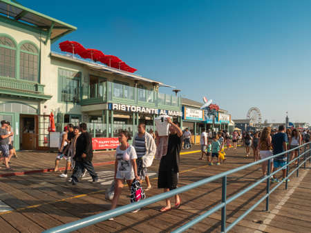 SANTA MONICA, USA - JUNE 25, 2016: View of crowd walking by Santa Monica pier in summer.のeditorial素材