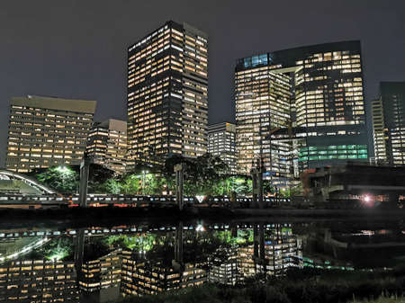 Night view of buildings on marginal and river pines.のeditorial素材