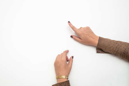 Top view of a business woman pointing at something using her hands with copy space.