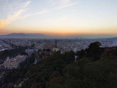 Aerial view of the port and the city of malaga in spain at sunset.
