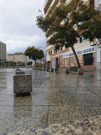 Malaga, Spain - February 22, 2021: iew of famous MÃ¡laga square during the rain.のeditorial素材