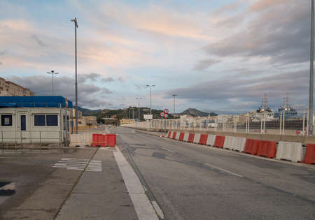 Malaga, Spain - February 21, 2021: View of Malaga harbor with some ships in the background at dusk.のeditorial素材