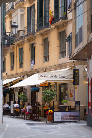 Malaga, Spain - June 19, 2021: People eating in restaurants at the historic center of Malaga in Spainのeditorial素材