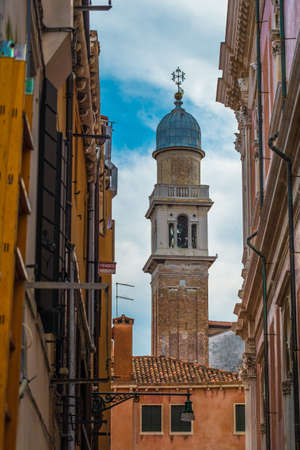 View of Church bell between buildings in Venice, Italyの写真素材