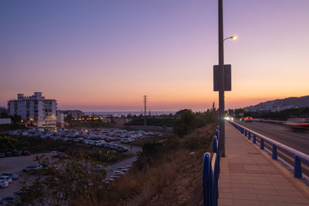 Beautiful avenue view of Nerja city at duskの写真素材