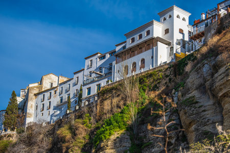 View of buildings on top of gorge in Ronda, Spain.の写真素材