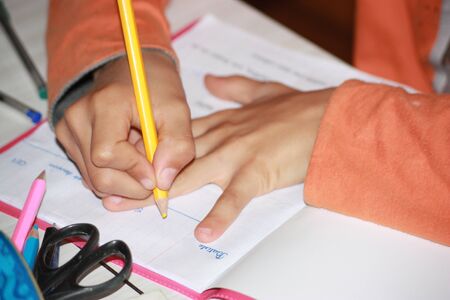 boy doing his homeworkの写真素材