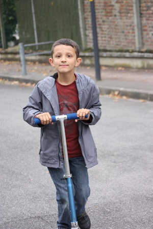 boy with scooterの写真素材