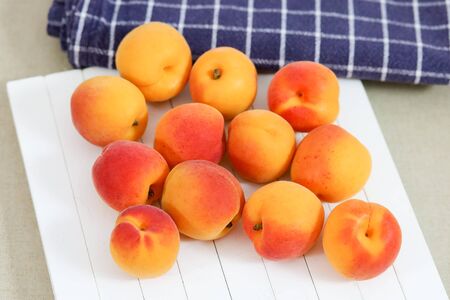 several apricots on a tableの写真素材