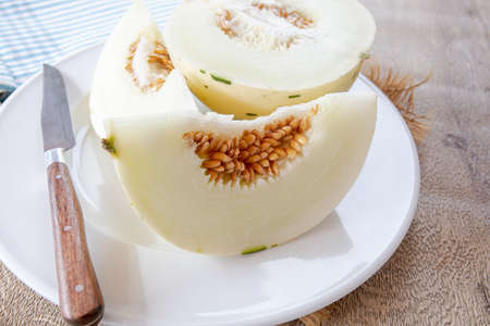 white melon cut in a plateの写真素材