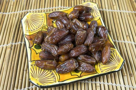 dish of dried dates on a table