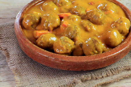 meatball dish with curry sauceの写真素材