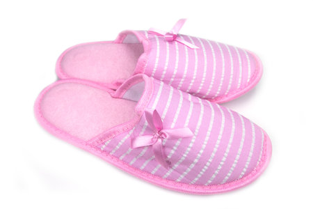 pair of pink slippers for women isolated on a white backgroundの写真素材
