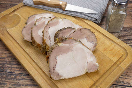 roast pork cooked on a cutting boardの写真素材
