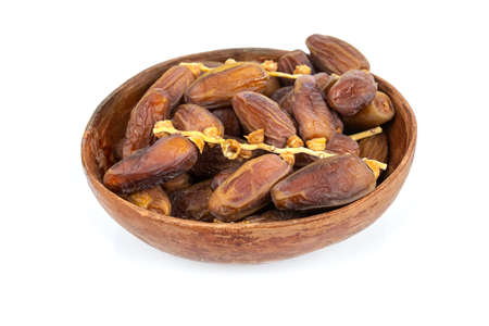 dish of dates isolated on a white background