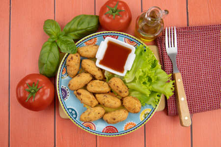 several accras on a plate