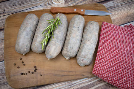 raw andouillettes on a cutting boardの写真素材