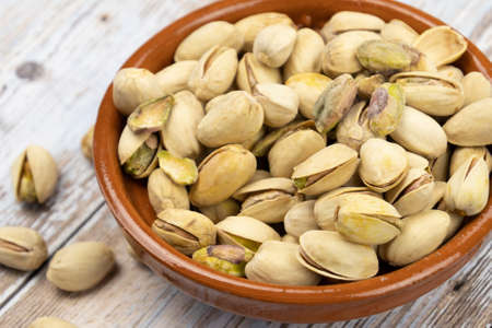 dish of roasted pistachios on a table