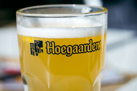glass of Hoegaarden beer on a tableのeditorial素材