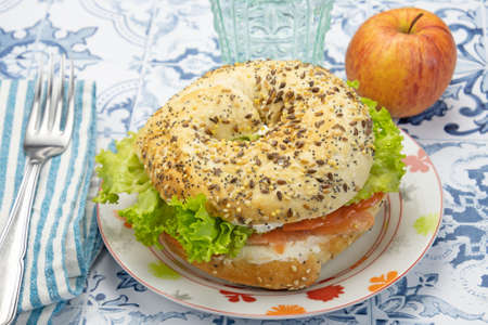 sandwich with salmon, cheese and vegetablesの写真素材