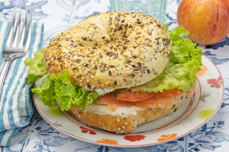 sandwich with salmon, cheese and vegetablesの写真素材