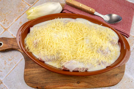 dish of endives with ham on a tableの写真素材