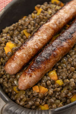 sausages and lentils dish on tableの写真素材