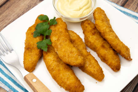 breaded chicken strips with sauce