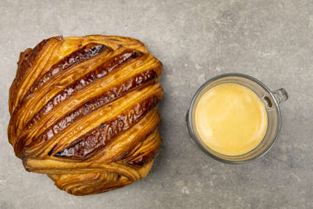 chocolate bread and coffee in glass cup on table