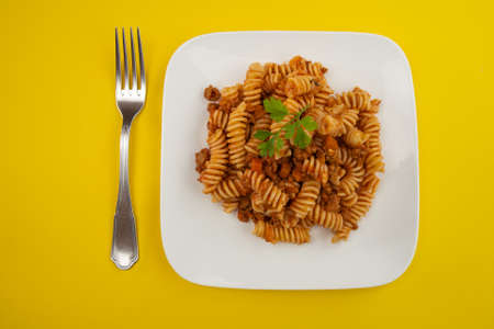 plate of pasta bolognese isolated on a white backgroundの写真素材